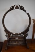 An Oriental hardwood embroidery or dinner gong frame, width approx. 37cm