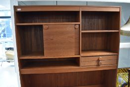 A vintage teak effect lounge unit, width approx. 127cm