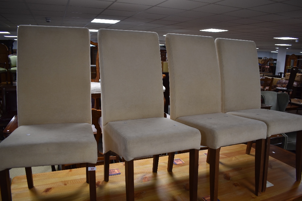 A set of four modern suedette dining chairs