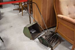 A Greens Moniter push along lawnmower