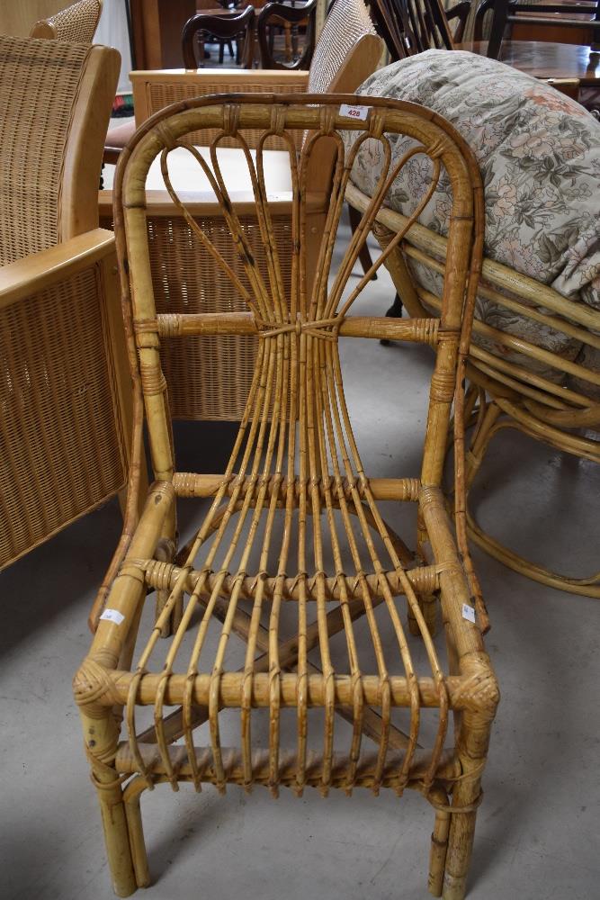 A vintage bamboo dining chair