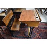 A Victorian and later school desk having cast iron frame, width approx. 61cm