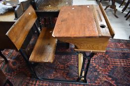 A Victorian and later school desk having cast iron frame, width approx. 61cm