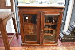 A Victorian oak smokers or similar cabinet, width approx. 58cm