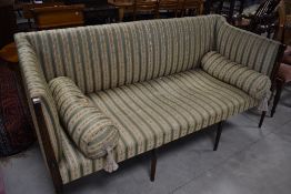 An early 20th Century stained frame settee having Regency style upholstery, width approx. 183cm