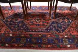A traditional Persian rug approx. 205 x 127cm