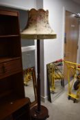 An early 20th Century mahogany standard lamp column on trefoil base