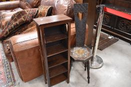 A traditional spinning chair and a modern narrow shelf of small proportions