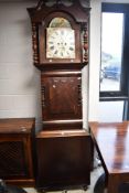 A 19th Century mahogany long cased clock having 8 day movement and painted arch dial with roman