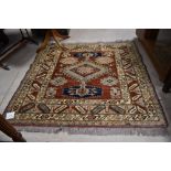 A traditional rug in the Persian style, approx. 140 x 128cm