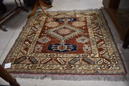 A traditional rug in the Persian style, approx. 140 x 128cm