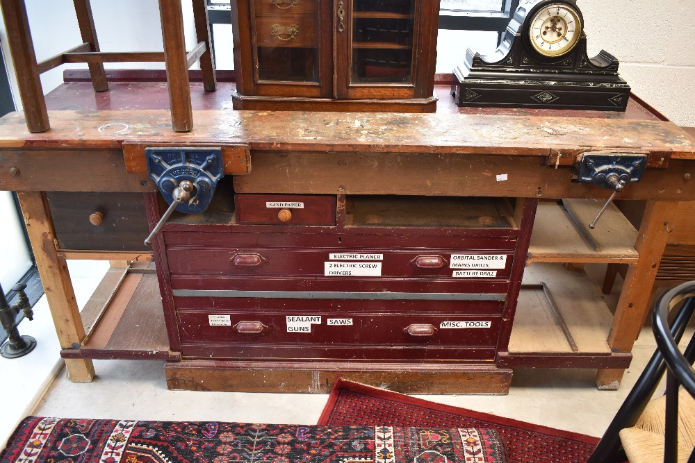 A traditional wooden work bench with vices attached and drawers under, width approx. 183cm