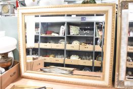 A modern wall mirror having distressed finish, approx. 94 x 74cm