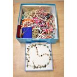 An assortment of costume jewellery, including faux pearls, beaded jewellery and cufflinks