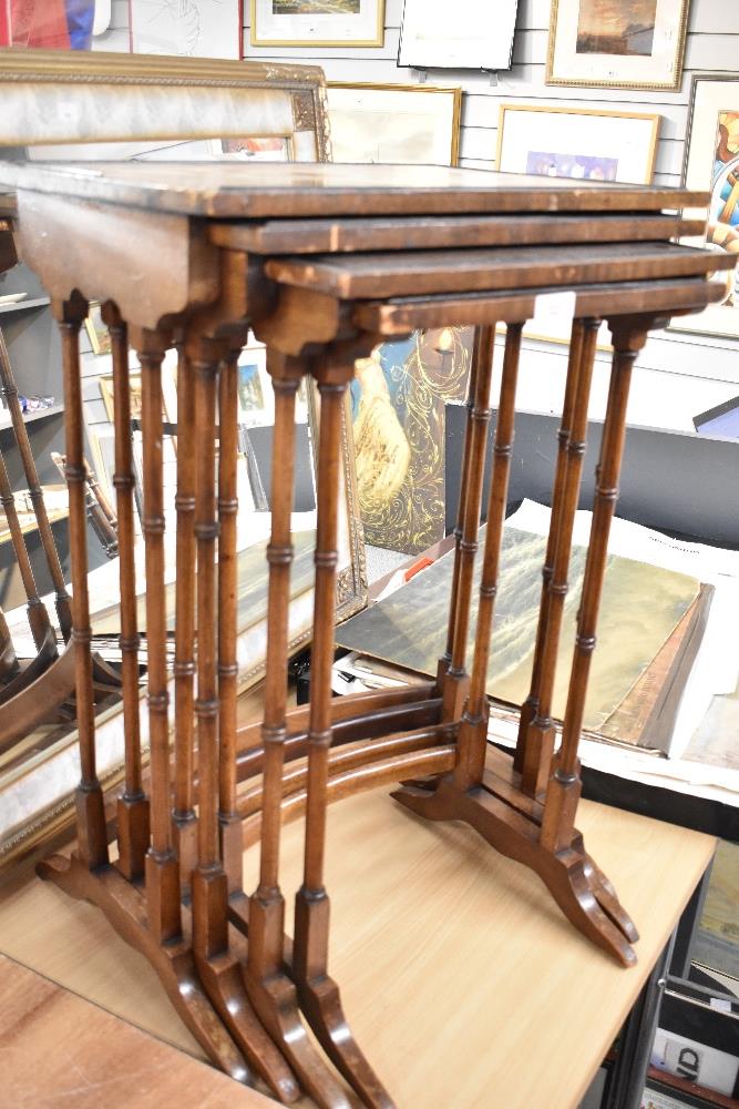 A reproduction mahogany quartetto nest of the tables in the Edwardian style (as found with damage to
