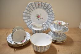 A Crown Staffordshire part tea service having a pale blue striped design with hand painted pink