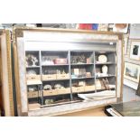 A modern wall mirror having marble effect and gilt surround, approx. 107 x 78cm