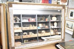 A modern wall mirror having marble effect and gilt surround, approx. 107 x 78cm