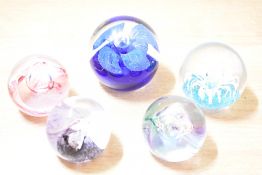 A Caithness 'Mooncrystal' pattern glass paperweight, h5cm, sold together with four similar