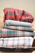 A small collection of mainly tartan fabric in long lengths including approximately 4 metres of