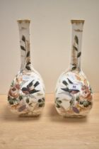 A pair of late 19th-century German Royal Bonn porcelain mantle vases, featuring tall, slender