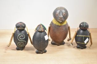 A quantity of 20th-century South African tribal pottery ceremonial dolls, featuring beaded detailing