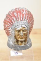 A 20th-century painted and cast metal Guy Motors Native American head car mascot, marked to front,