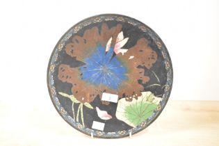 A 19th-century Japanese cloisonné enamel charger, presumed Meiji period, featuring a selection of