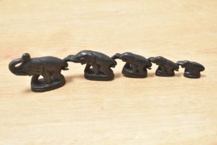 Set of five 20th-century iron tribal art graduated elephant-shaped weights, in which the trunk of