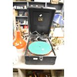 An early 20th century 'His Masters Voice' cased gramophone of typical style and form, measuring 28cm