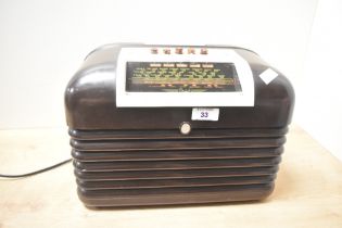 A mid 20th-century Art Deco-style Bush DAC10 radio, with a bakelite cabinet and faux tortoiseshell