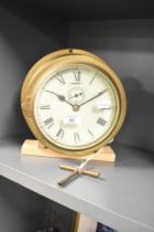 A late 19th to early 20th-century British brass ships bulkhead clock