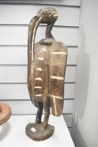 A small 20th-century West African carved Senufo Sejen Hornbill (Kalao bird), presumed to be from the