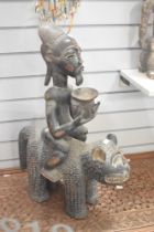 A 20th-century African Tribal Art carved wood sculpture, presumed to be a divination object and