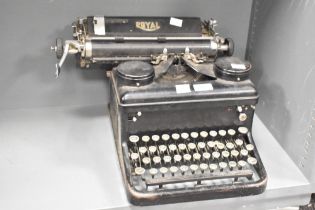 An early 20th-century Royal manual typewriter, featuring elegantly shaped keys in a black finish,