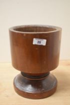 A large 20th-century 'treen' apothecary mortar, made from a single piece of wood, unmarked, 22cm,