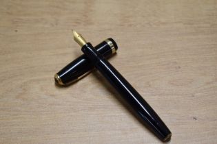 A Parker Duofold button fill fountain pen in Black with broad decorative cap band having Parker
