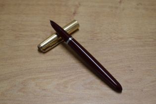 A boxed Parker 51 aerometric fill fountain pen in Burgundy with Rolled Gold cap