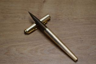 A boxed Parker Falcon Insignia converter fill fountain pen in Gold