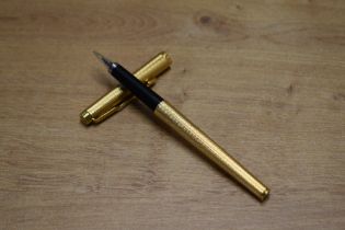 A Parker 180 converter fill fountain pen in Gold Fine Barley