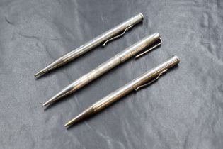 Three Yard o Led mechanical pencils. One plain round Sterling Silver (some dents). Two hallmarked
