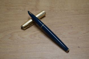A Parker 61 Custom aerometric fill fountain pen in Teal with Rolled Gold cap