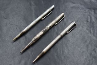 Three round Yard o led mechanical pencils. All hallmarked Silver, Birmingham 1974, London 1957 and