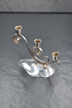 A Danish Mid-Century silver plated triple candlestick holder, the trio of sconces raised on a