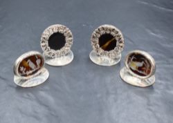 Four cased George V silver and tortoiseshell menu holders, two of circular form having a pierced