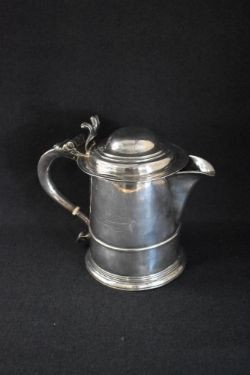 A Queen Anne silver tankard later conversion to a jug, of traditional form having a moulded lid,