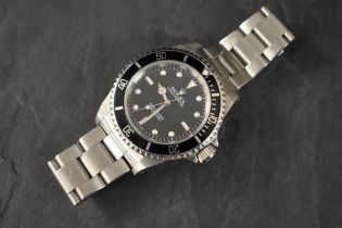 A Rolex Oyster Perpetual Submariner wristwatch, the black dial having baton and dot numerals, on a