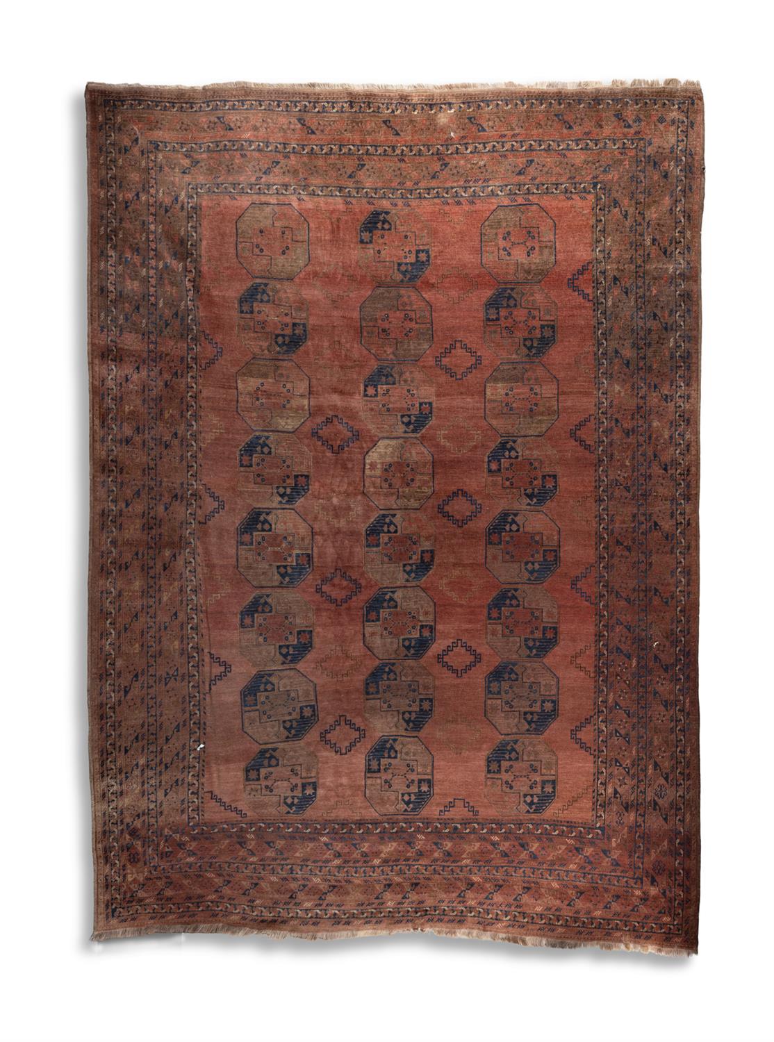 A SEMI-ANTIQUE AFGHAN CARPET, TURKOMAN, C. 1910, 393 X 308CM the "goldwashed" carpet decorated