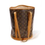 LOUIS VUITTON: A “MONOGRAM BUCKET GM” SHOULDER BAG The cylindrical shoulder bag in the maison’s