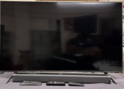 A Samsung UE55TU7100K Smart Television together with a Bomaker Odine 1 Soundbar